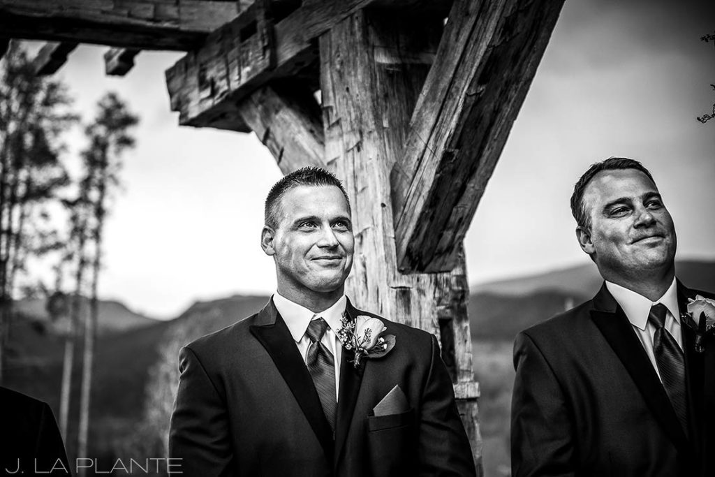J. La Plante Photo | Winter Park Colorado Wedding Photographer | Devil's Thumb Ranch Wedding | Groom Watching Bride Walk Down Aisle