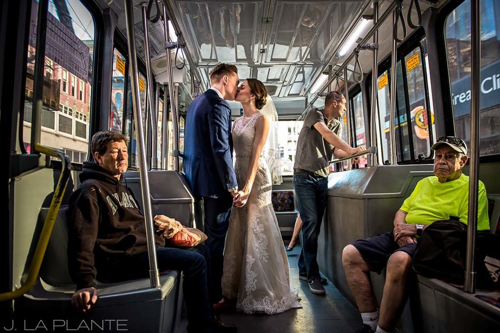 J. LaPlante Photo | Denver Wedding Photographers | Grand Hyatt Denver Wedding | Bride and Groom on 16th Street Mall Ride
