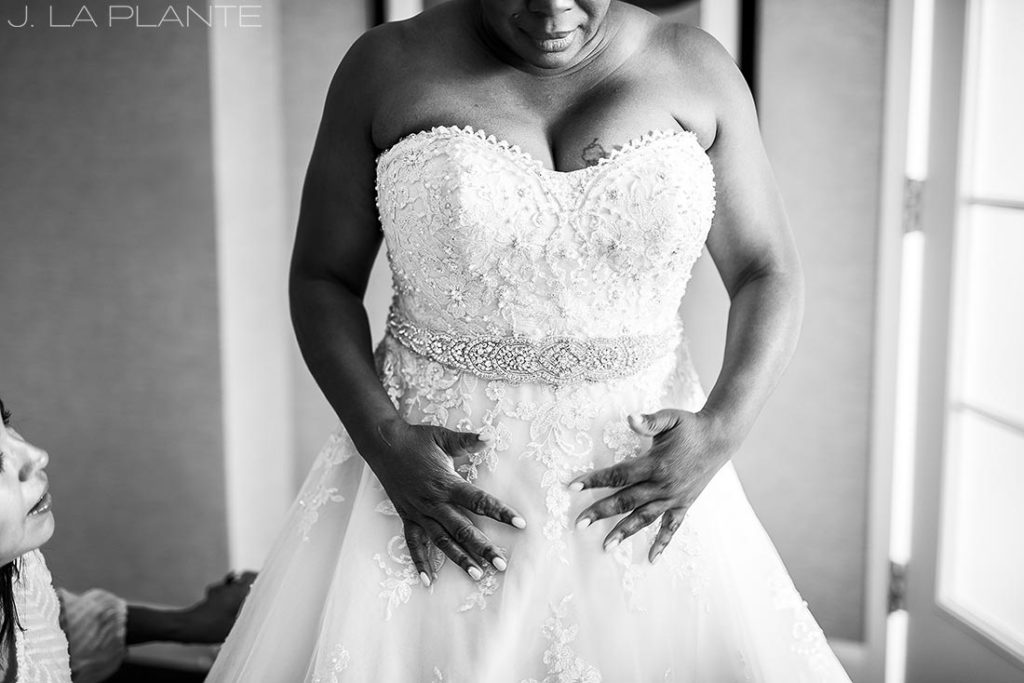 JW Marriott Cherry Creek Wedding | Bride getting into dress | Denver wedding photographer | J La Plante Photo