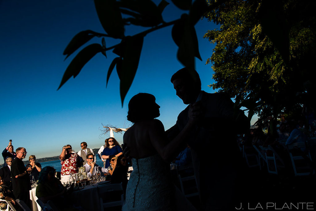 silhouette photo of bride and groom at wedding reception