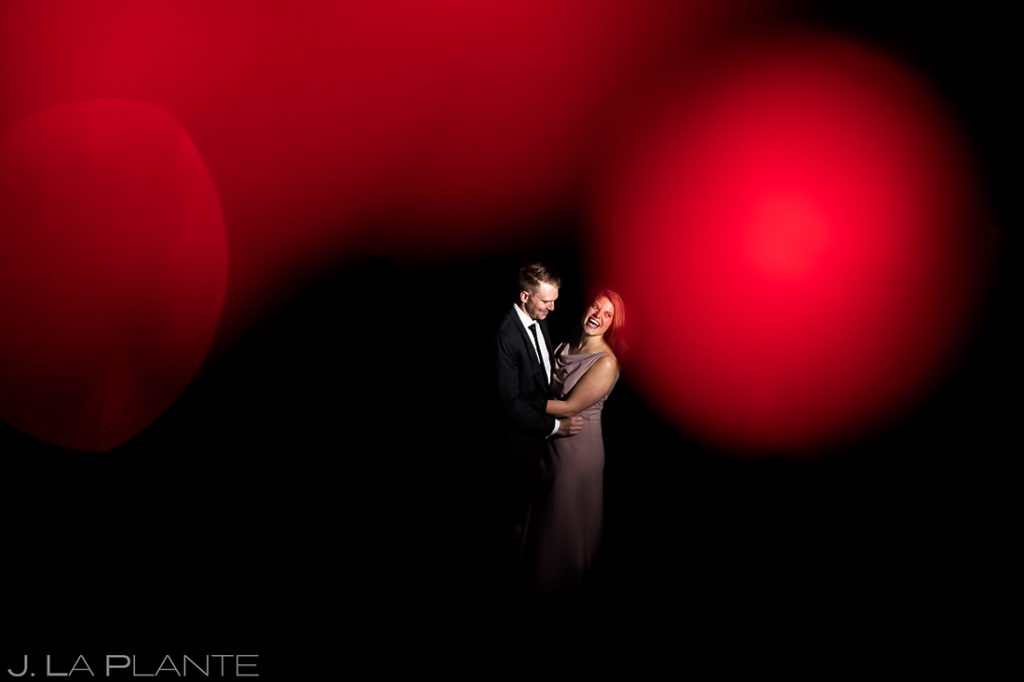 bride and groom portrait with christmas lights