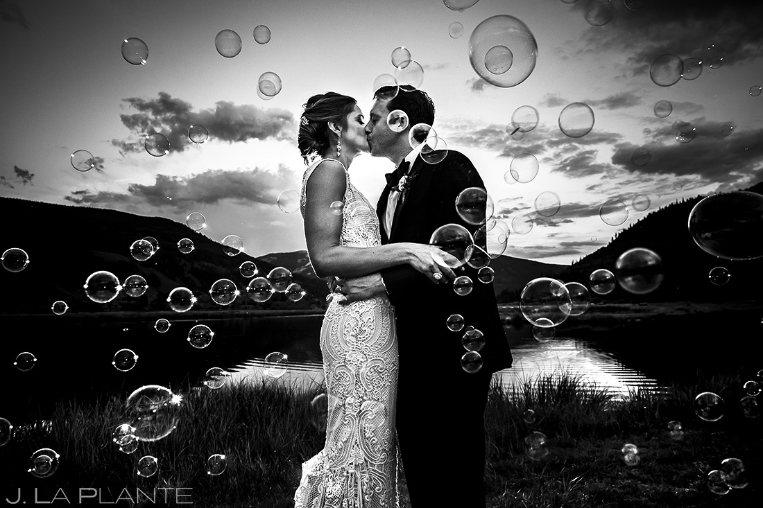 Bride and Groom Blowing Bubbles | Camp Hale Wedding | Vail Wedding Photographer | J. La Plante Photo
