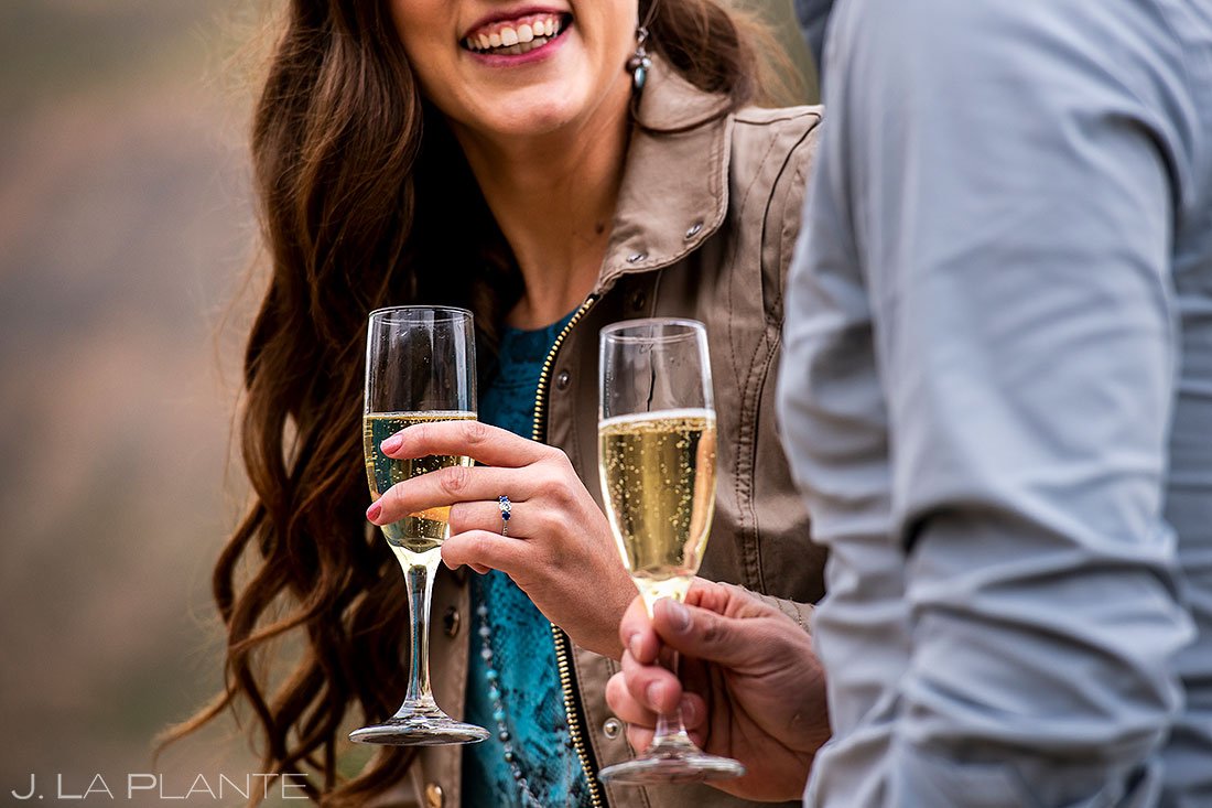 colorado engagement detail photos of ring and champagne