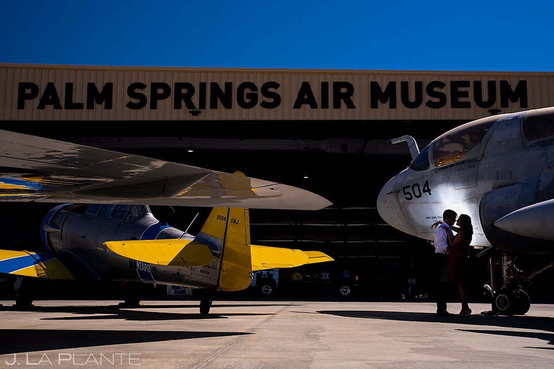 bride and groom to be at the palm springs air museum hanger