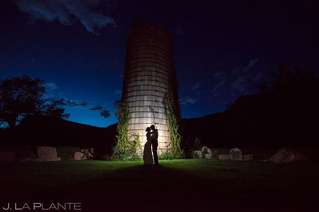 blue hour wedding photo of bride and groom by silo