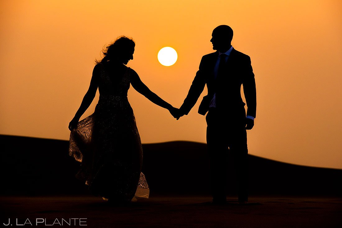 sunset portrait of bride and groom at the great sand dunes