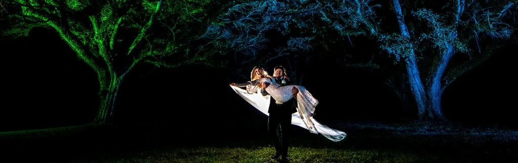 cool nighttime wedding photo of bride and groom at houston wedding
