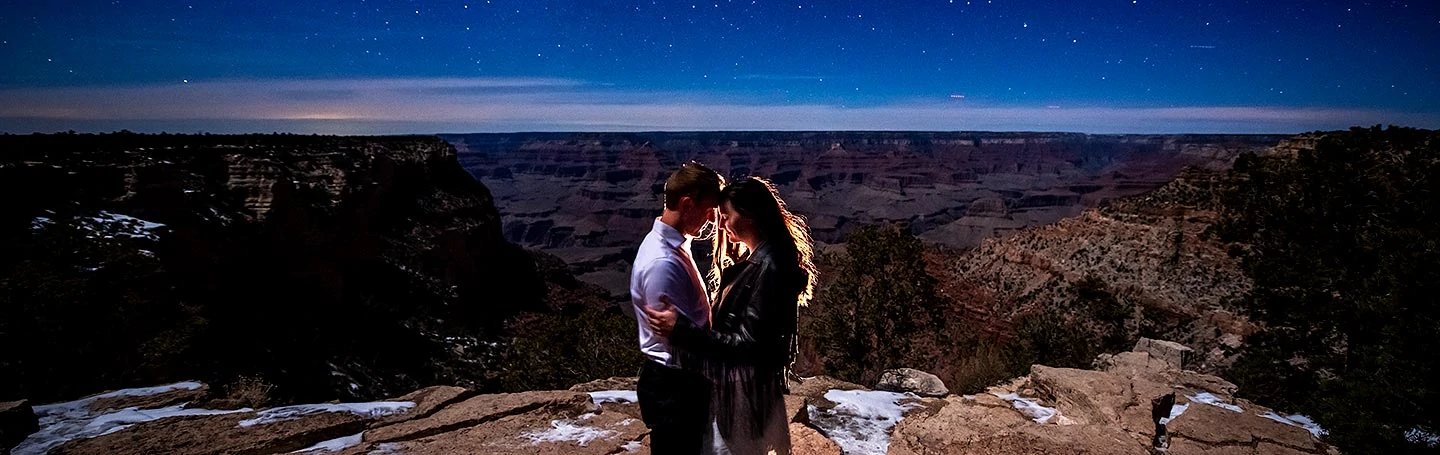 bride and groom to be posing under the stars