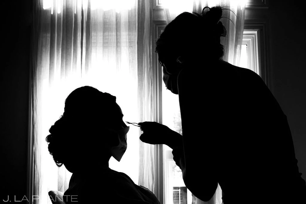silhouette of Colorado makeup artist at work