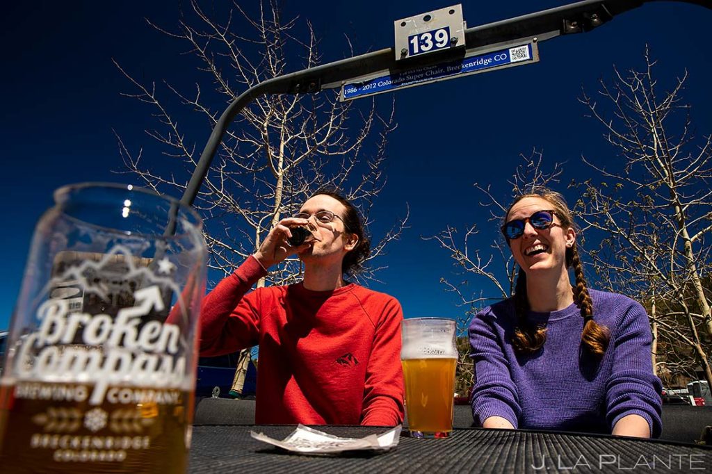 couple drinking at brewery before engagement session in Breckenridge, Colorado