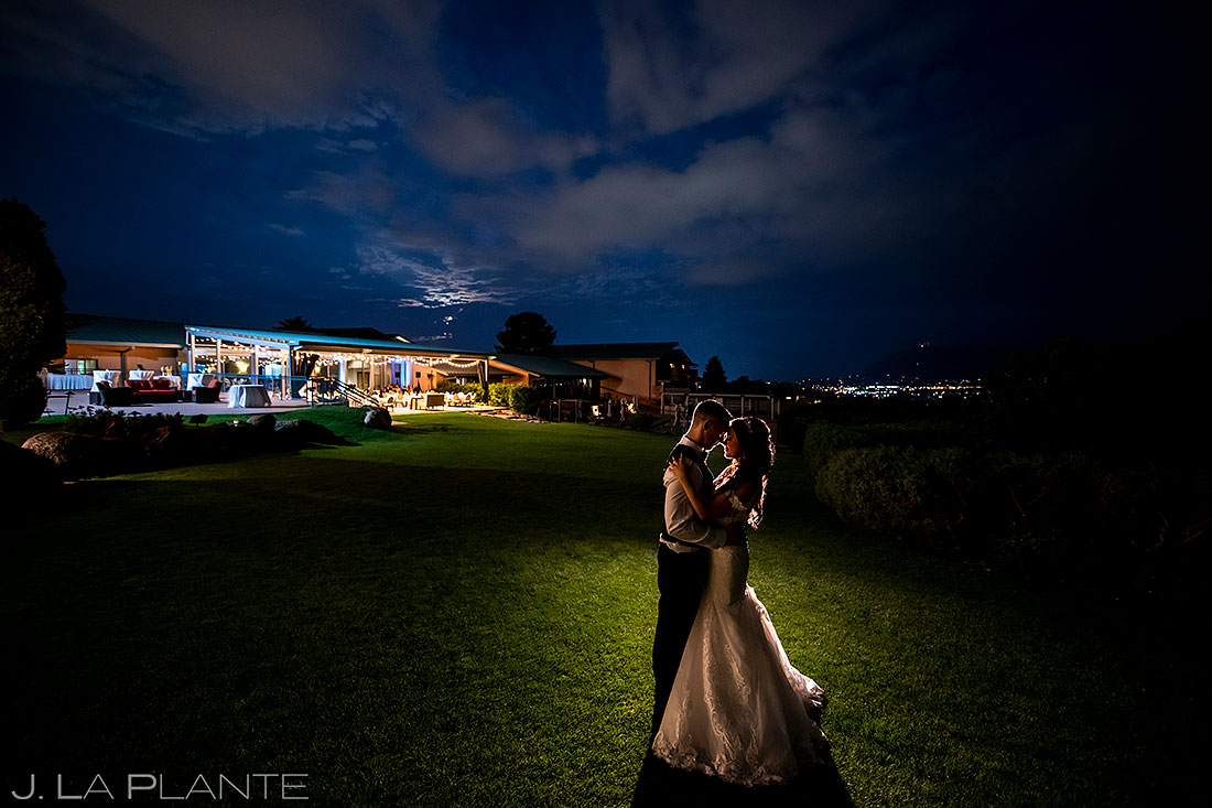 nighttime wedding photo of bride and groom at Garden of the Gods Resort wedding