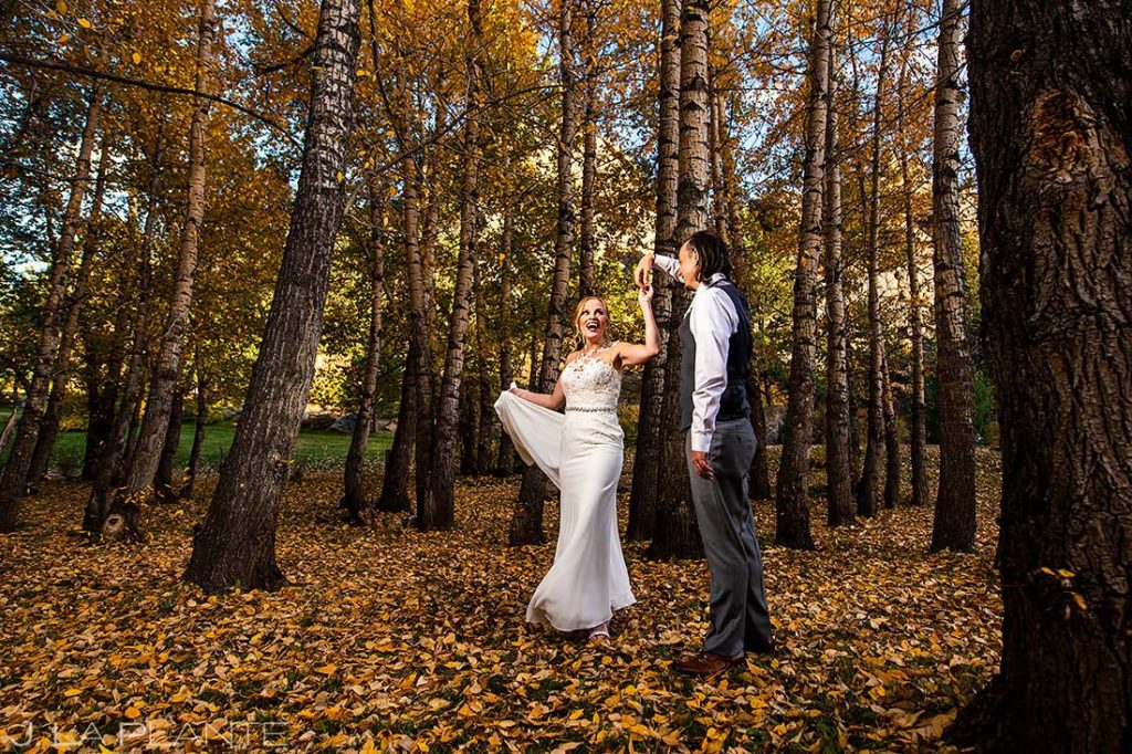 bride and groom with fall foliage in Estes Park Colorado