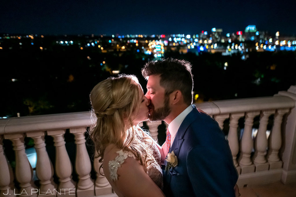 bride and groom in front of Colorado Springs city skyline