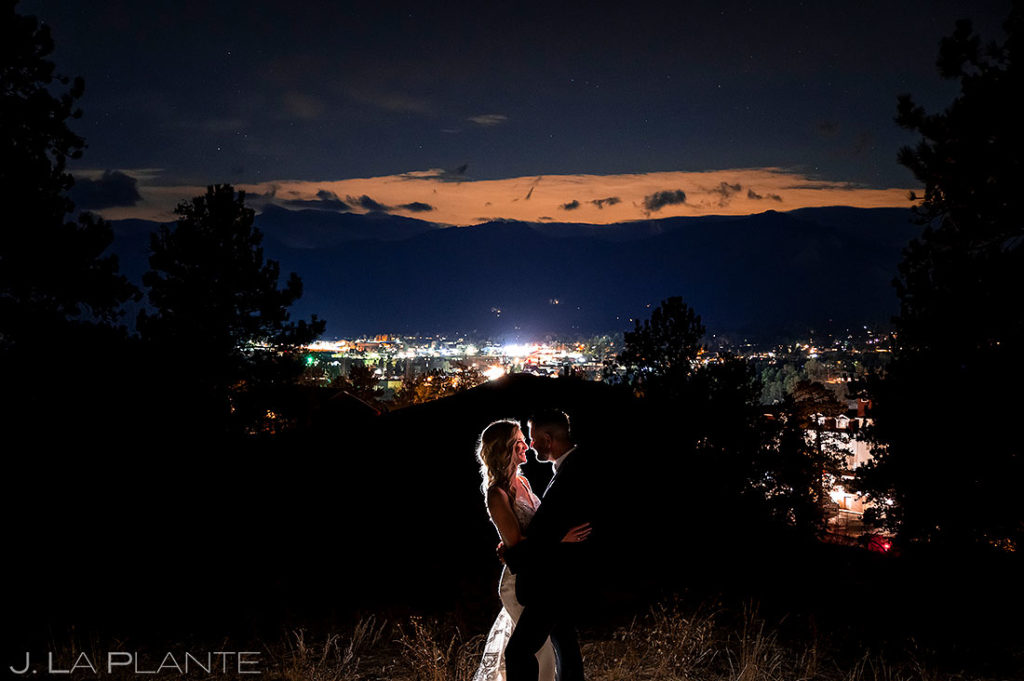 nighttime wedding portrait of bride and groom in Estes Park Colorado