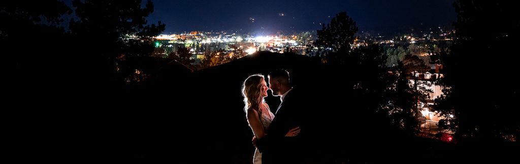 nighttime wedding portrait of bride and groom in Estes Park Colorado
