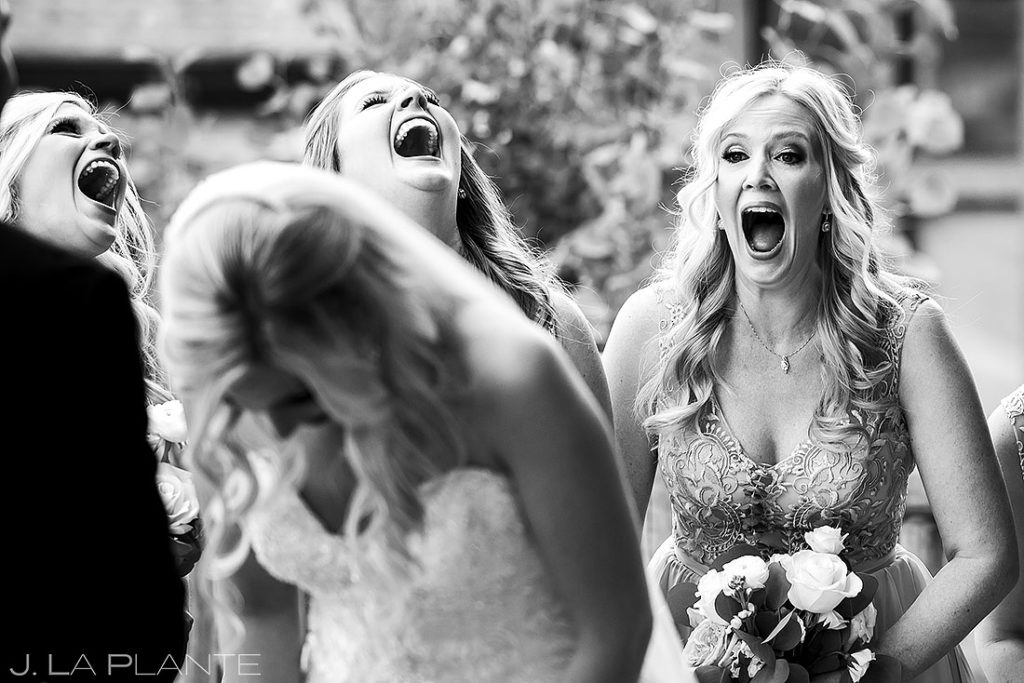bridesmaids erupting in laughter during vows