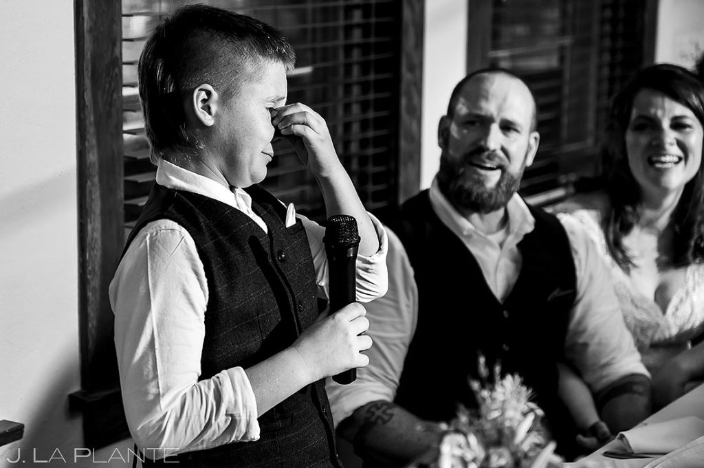 son of the groom crying during toast