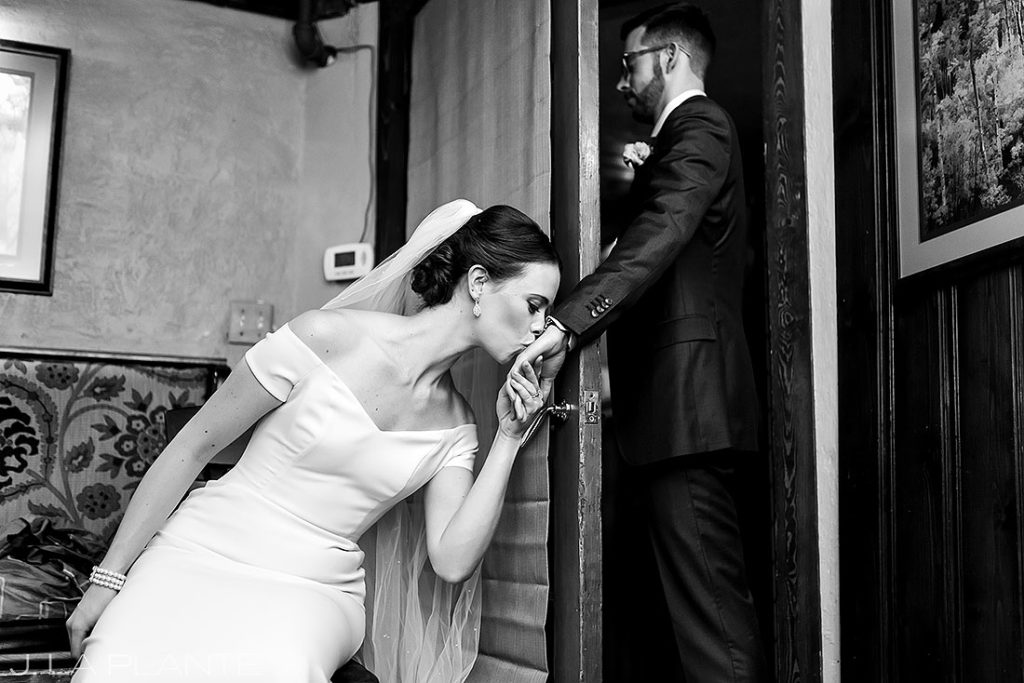 bride kissing the groom's hand