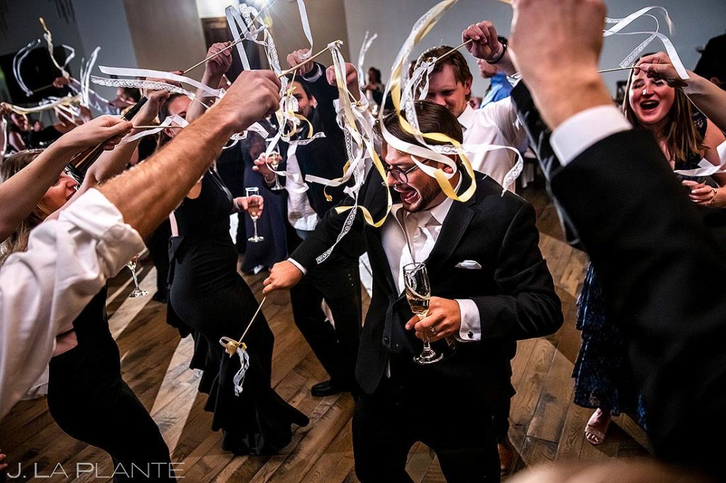 groom celebrating New Year's Eve during wedding reception