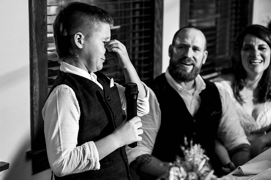 son of the groom crying during toast
