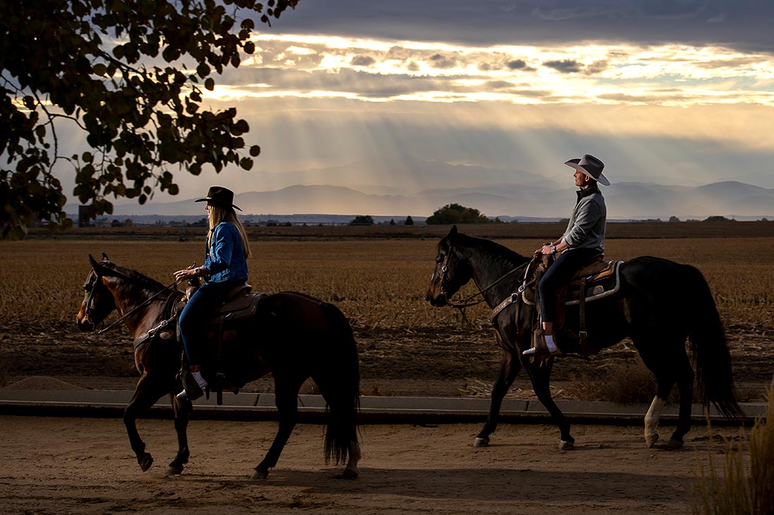 vibrant wedding photography horseback riding engagement in Colorado