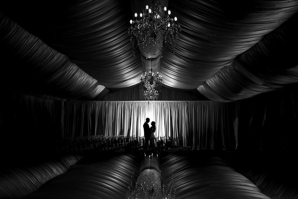 black and white silhouette photo of bride and groom