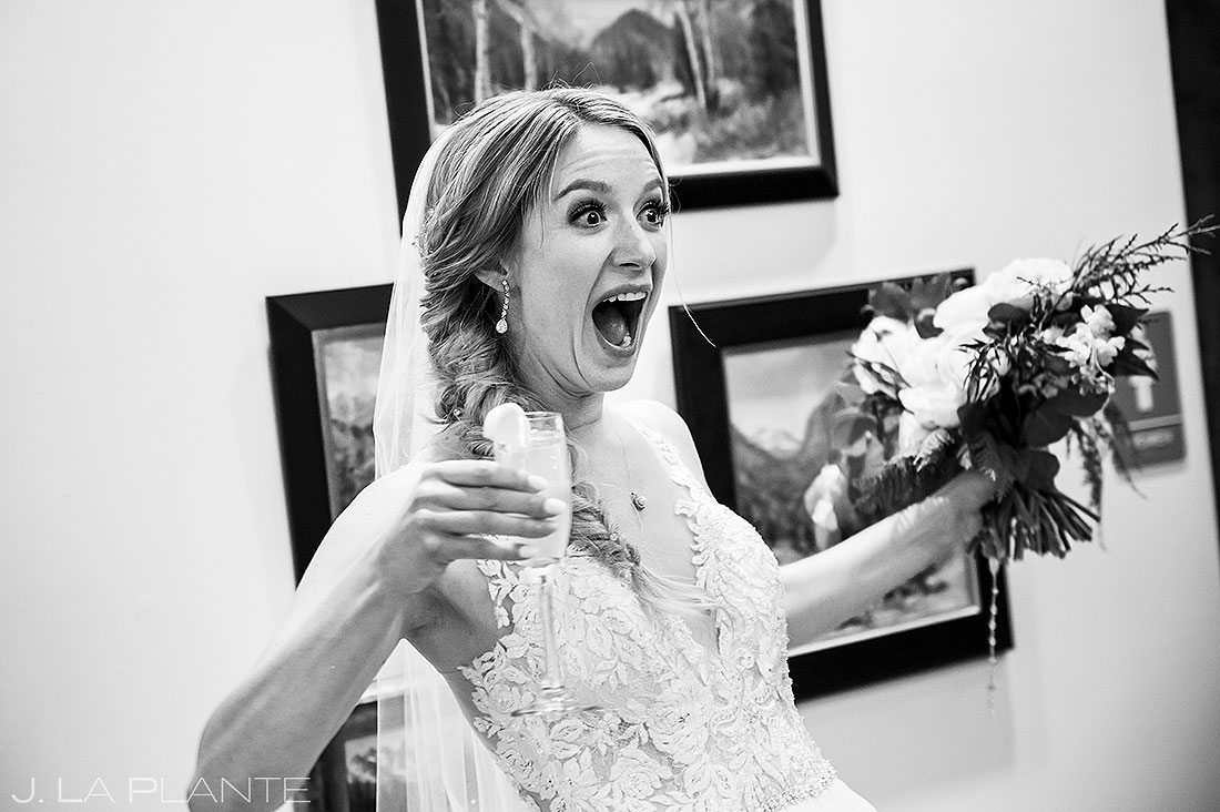 bride with signature cocktail and bouquet