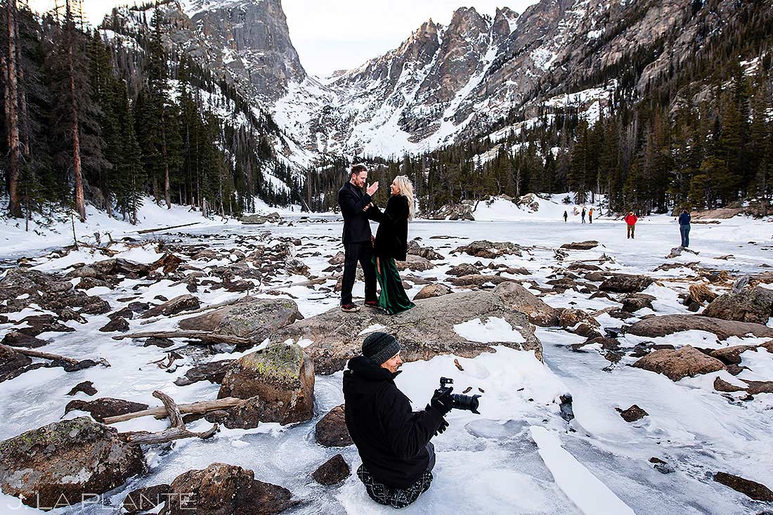 wedding photographer taking photos of bride and groom to be at Dream Lake