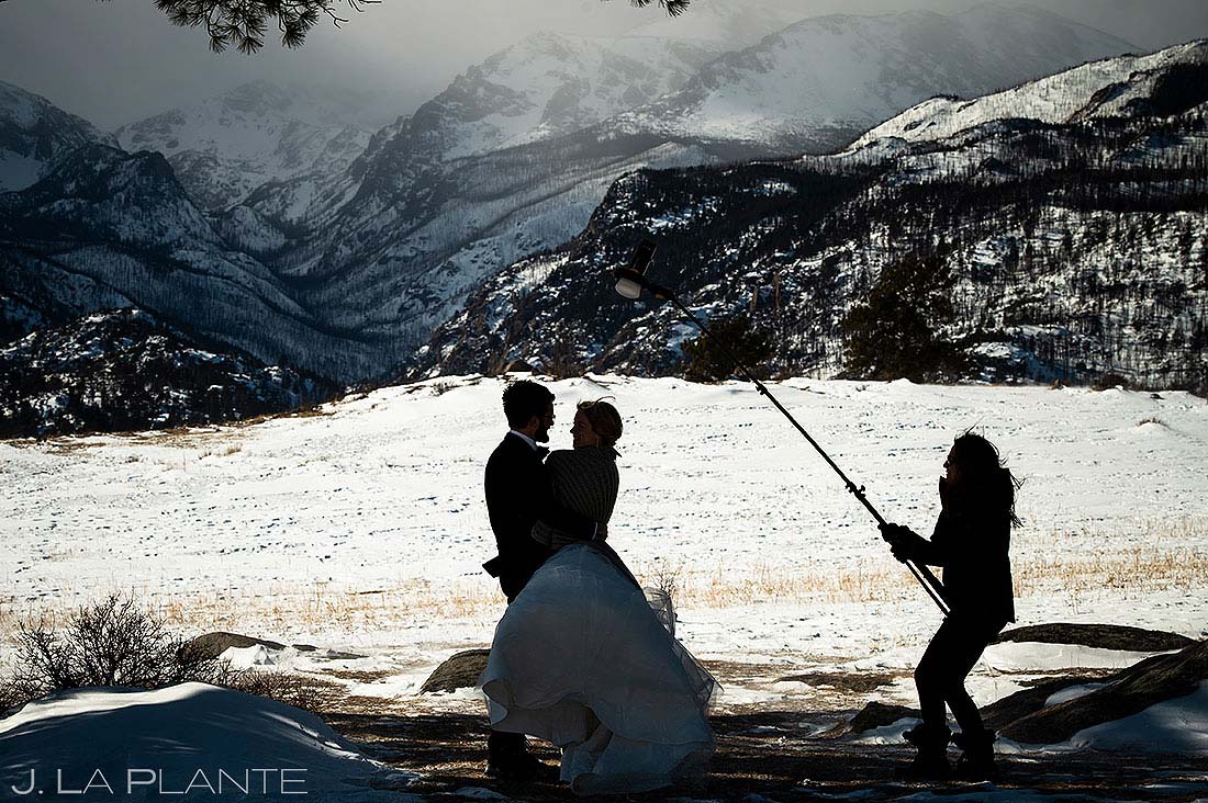 wedding photographer lighting photos of bride and groom in Rocky Mountain National Park