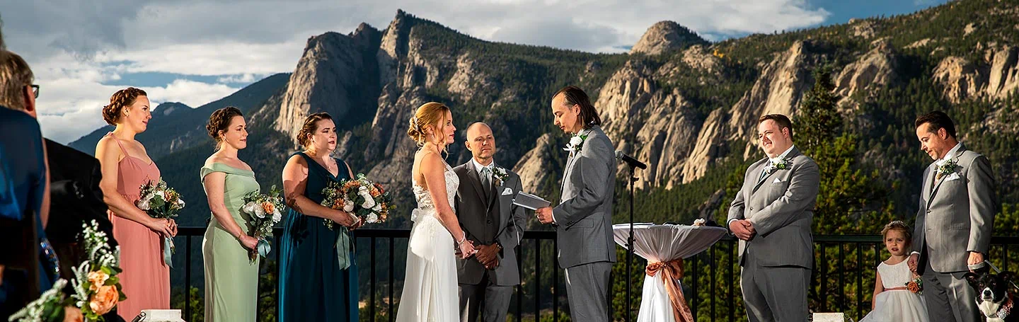 bride and grooms saying vows during wedding ceremony in Estes Park