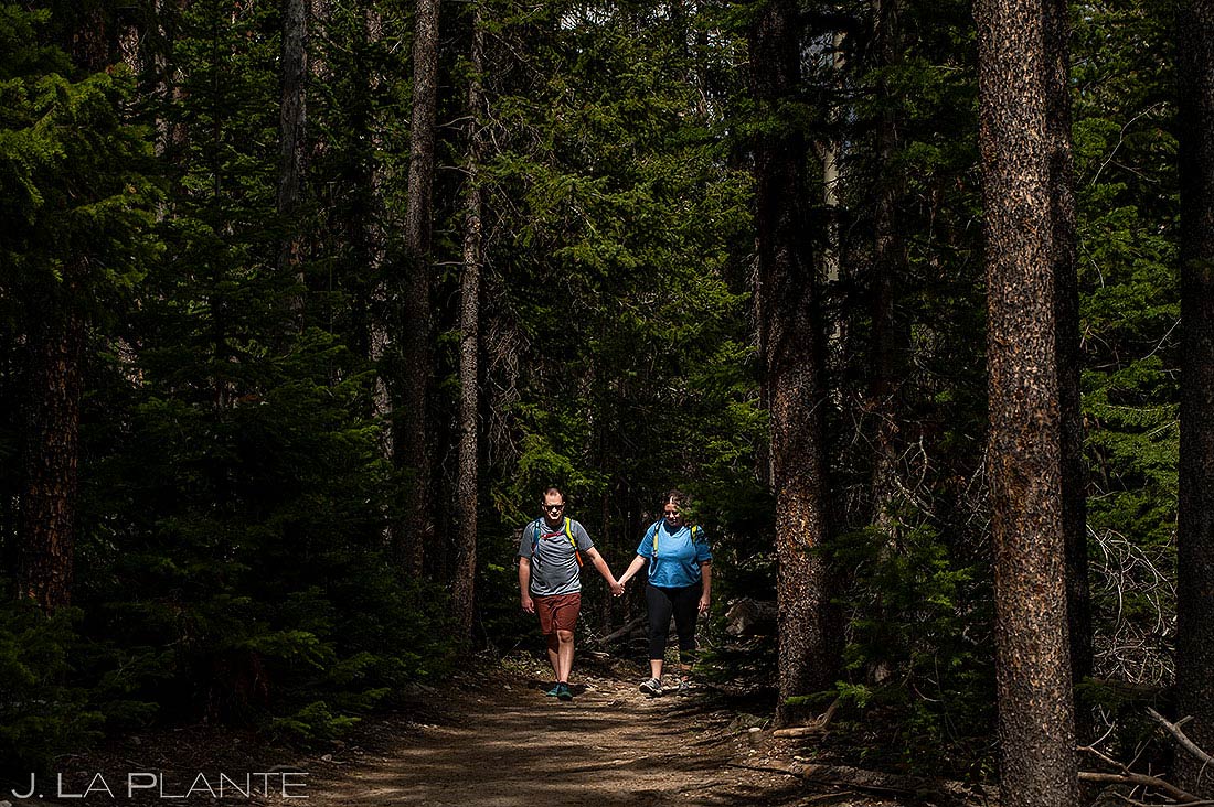 bride and groom to-be hiking for Ouzel Falls engagement session