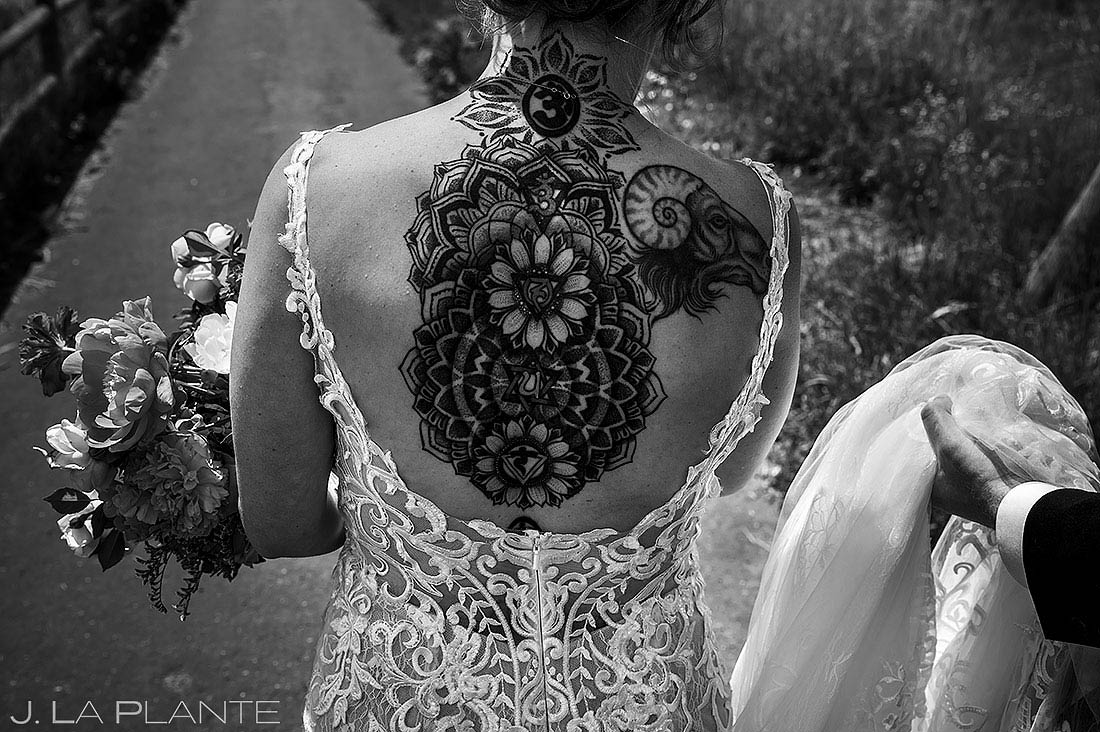 cool tattoo on bride's back