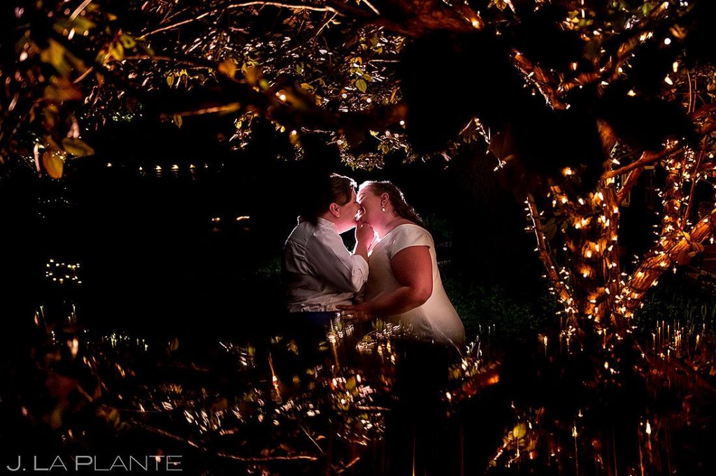bride and bride kissing at night at spring wedding at greenbriar inn