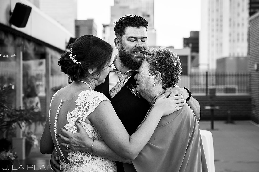 bride hugging mother during wedding reception