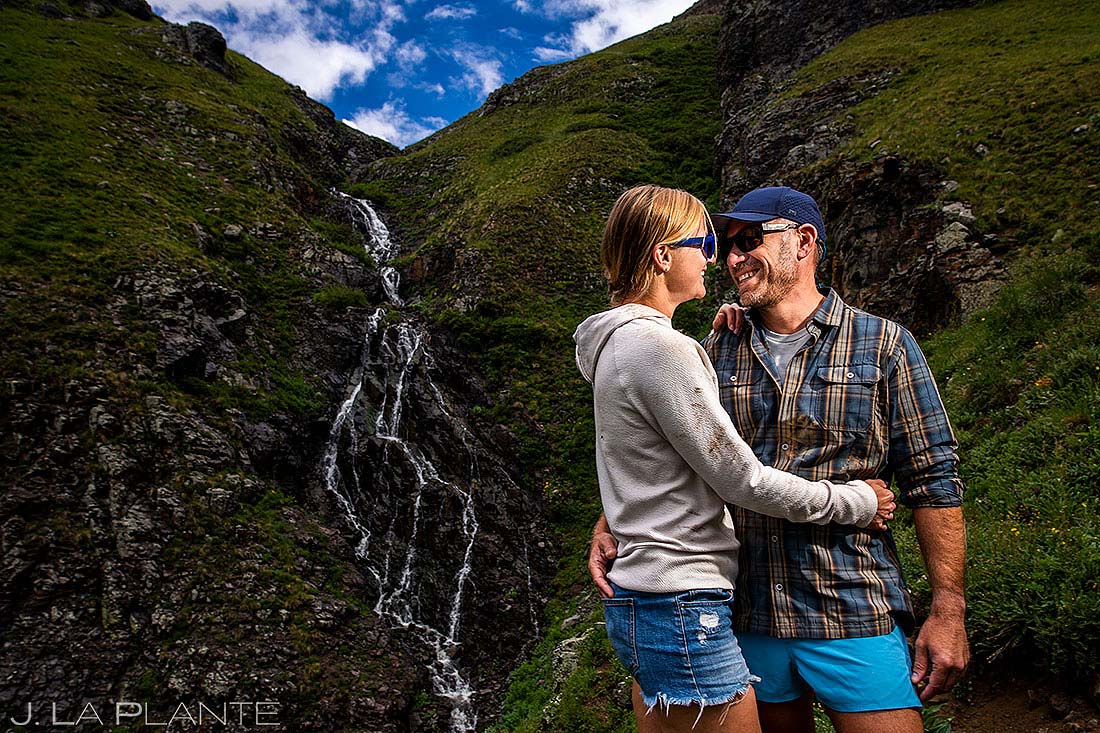 bride and groom at waterfall San Juan Mountains engagement