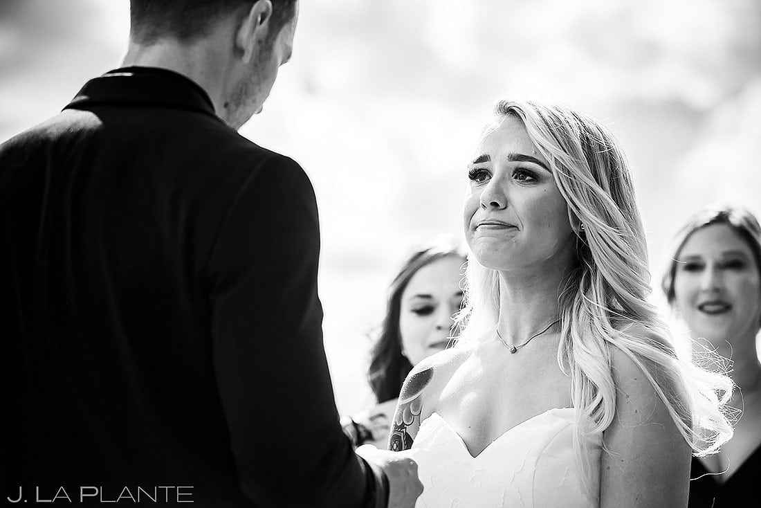 bride crying during vows at summer wedding at Estes Park Resort