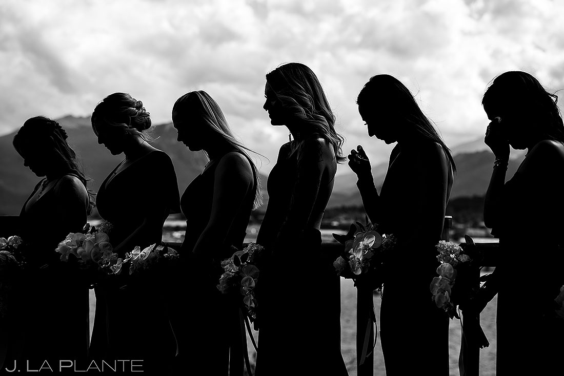 bridesmaids praying during wedding ceremony