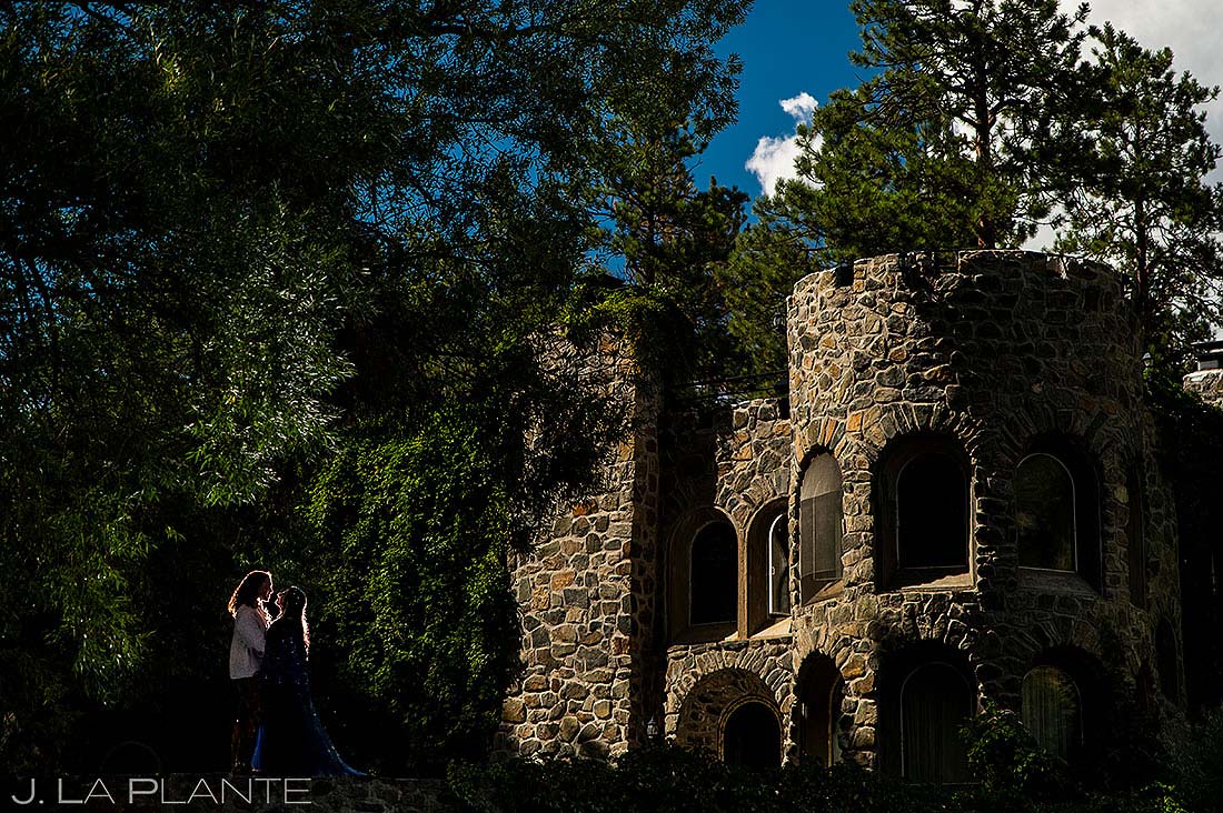 portrait of bride and groom at mountain castle