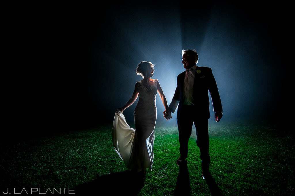 nighttime portrait of bride and groom at sanctuary wedding