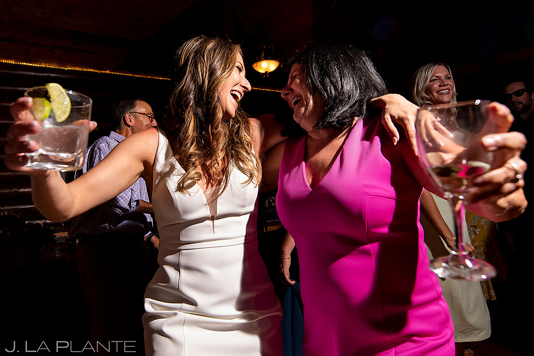bride hugging wedding guest during dance party