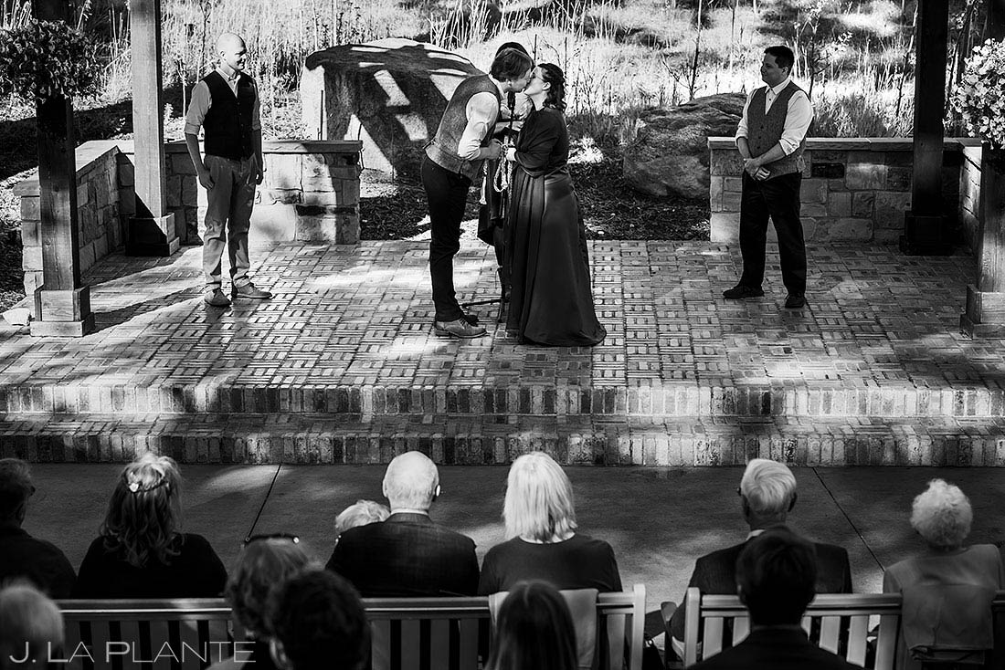 bride and groom first kiss at Della Terra wedding in Estes Park, Colorado