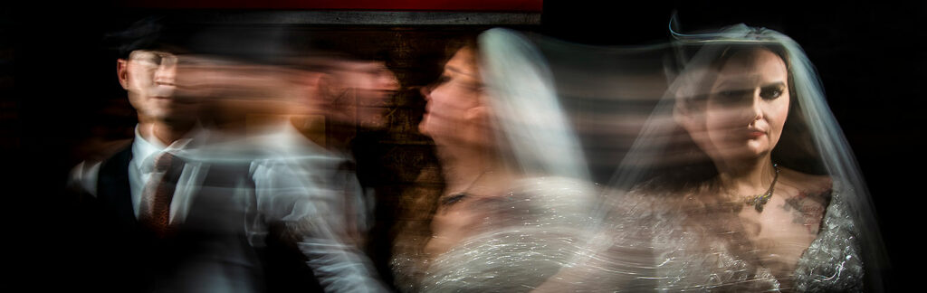 nighttime blurred motion portrait of bride and groom