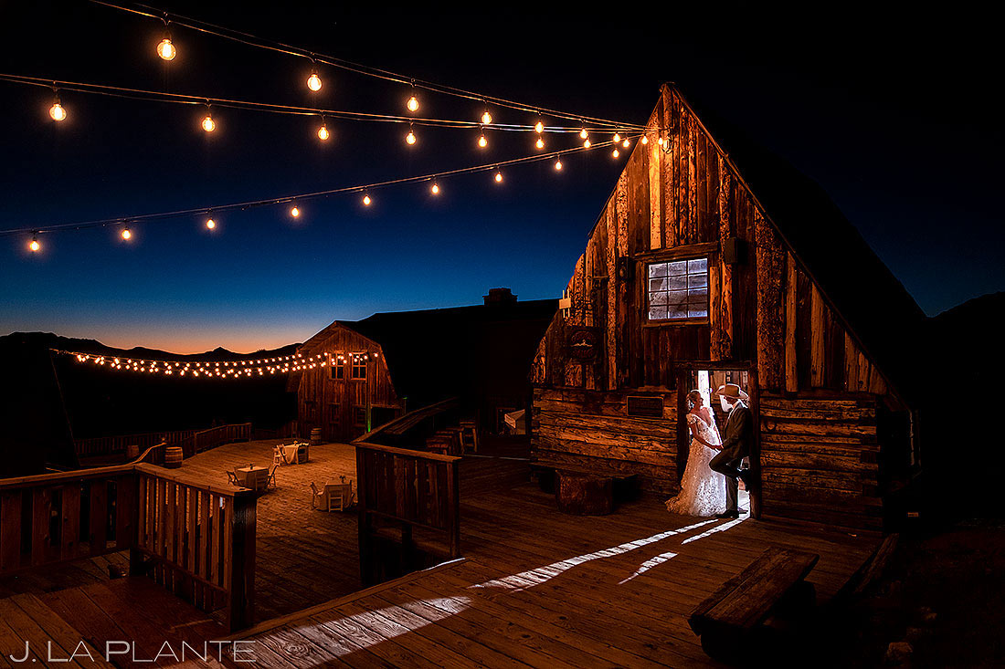 sunset portrait of bride and groom at western themed wedding