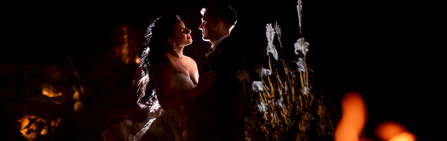 bride and groom by the fire at Cielo at Castle Pines wedding