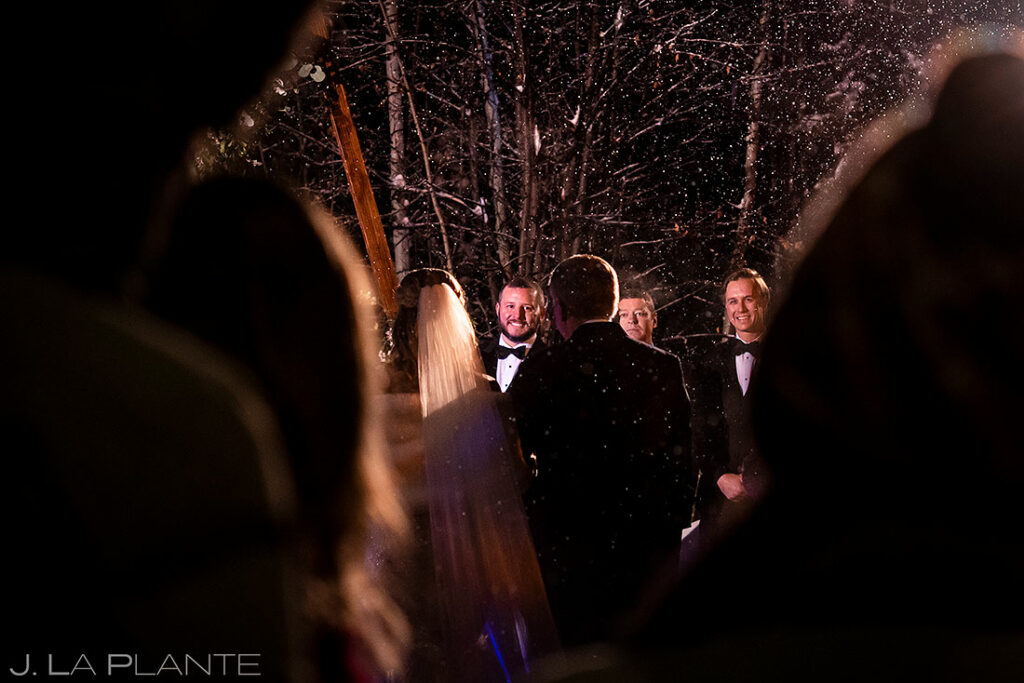 snowy nighttime ceremony at Donovan Pavilion wedding