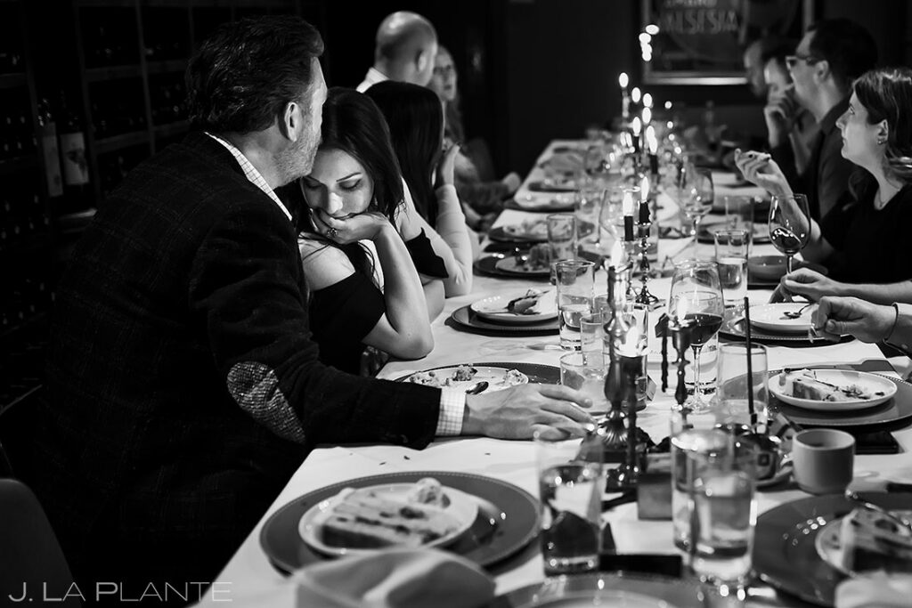 wedding guests eating cake at the head table