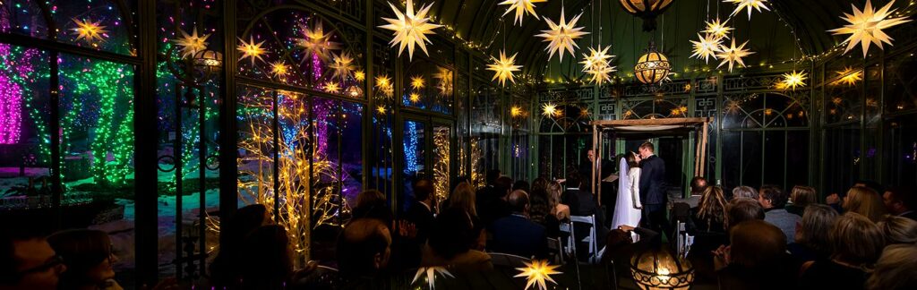 nighttime winter wedding ceremony at the Denver Botanic Gardens