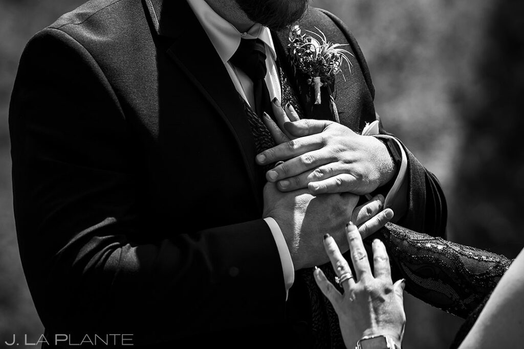 best wedding photos of 2022 couple holding hands during ceremony