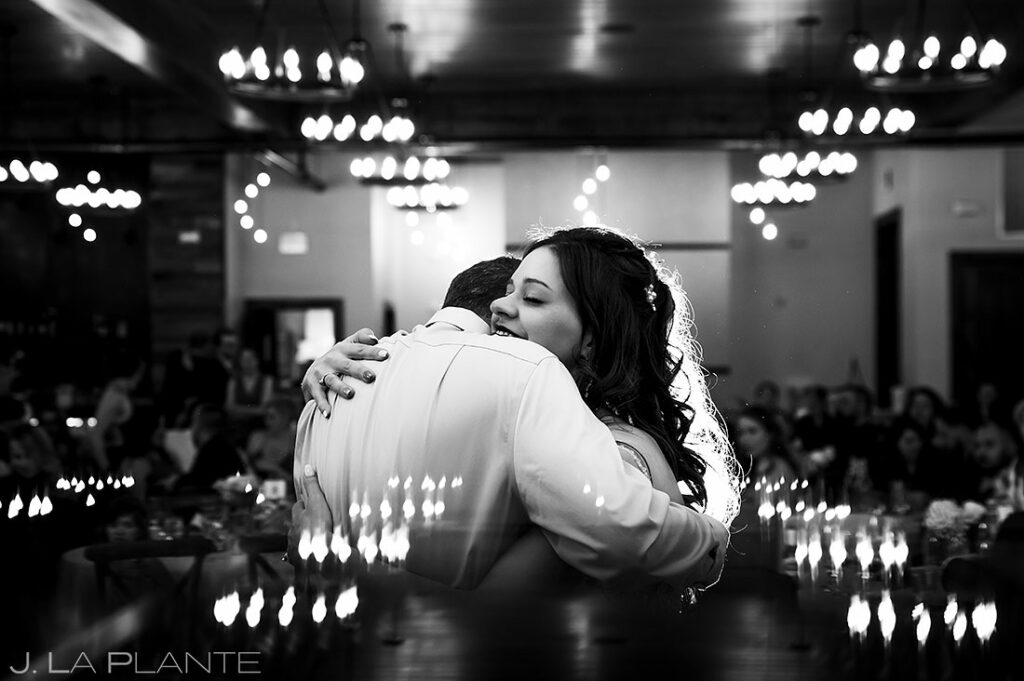 bride hugging her dad during father daughter dance