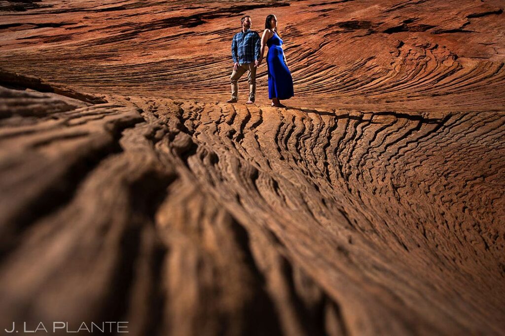 bride and groom to be on rock formations during Zion engagement